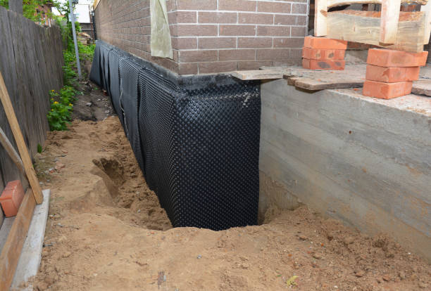 SJ Waterproofing Pros technician performing targeted Exterior Waterproofing assessment in Springport, IN